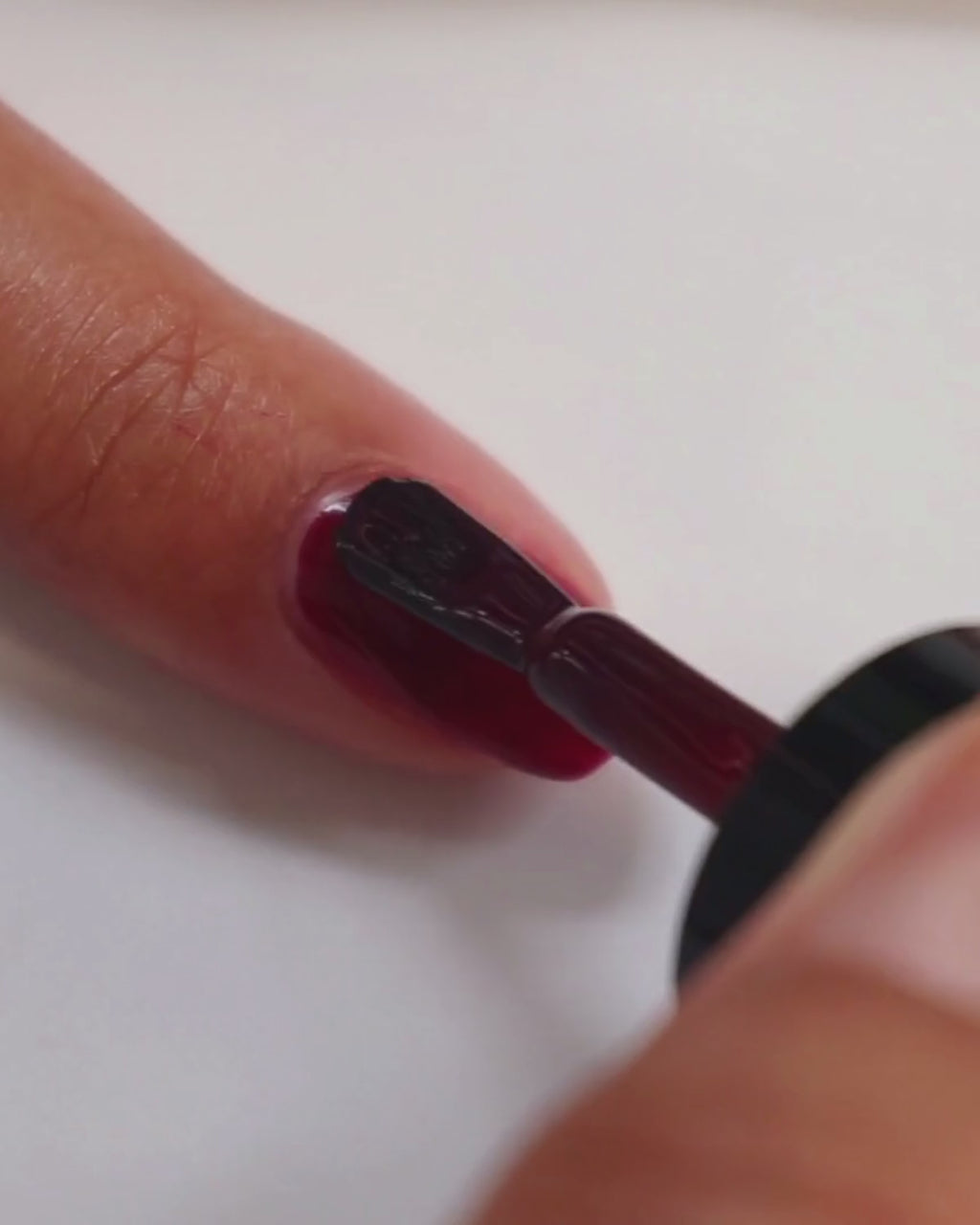 90s inspired burgundy nail polish