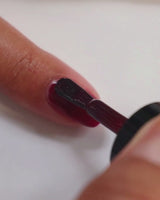 90s inspired burgundy nail polish